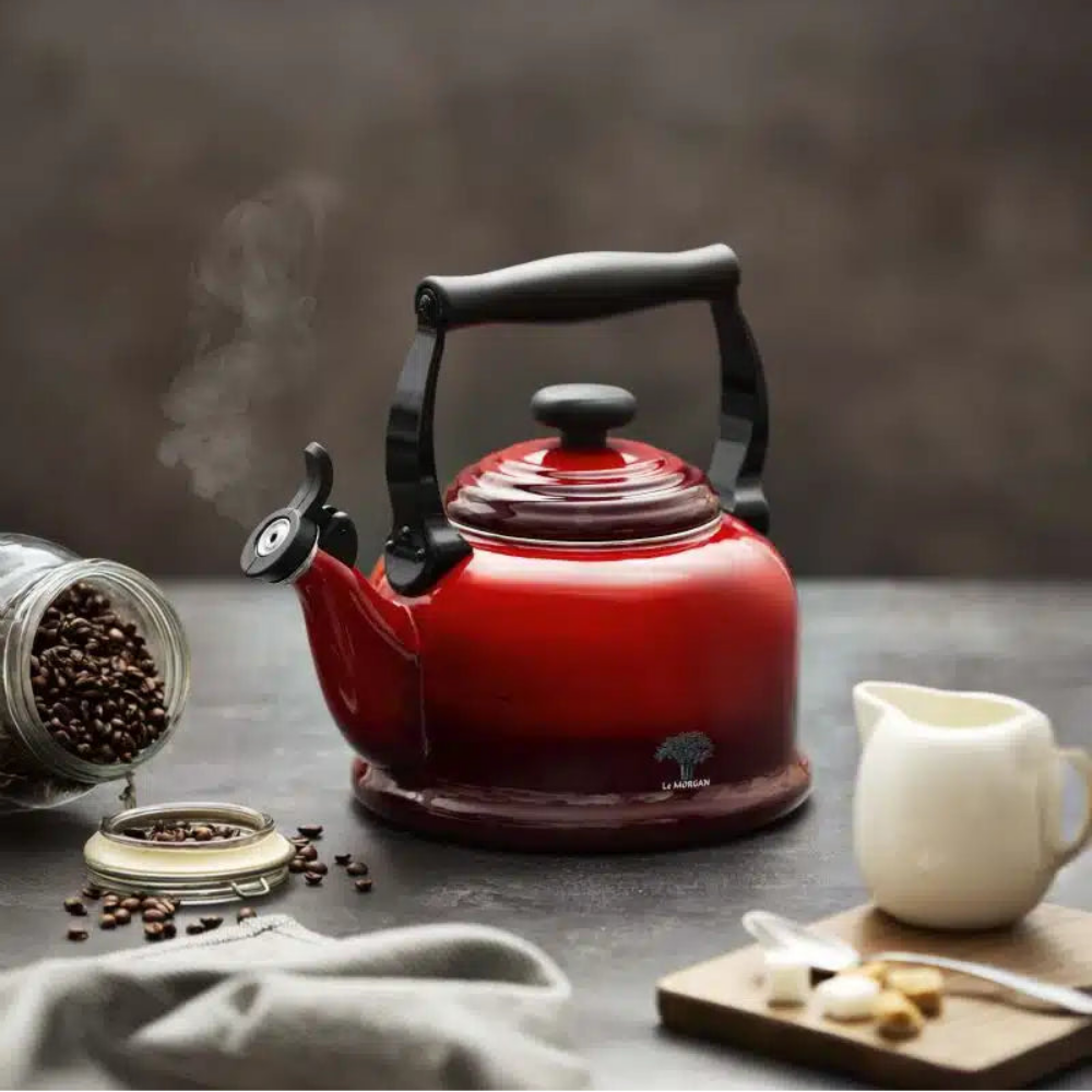 Ombre red kettle on a kitchen counter.