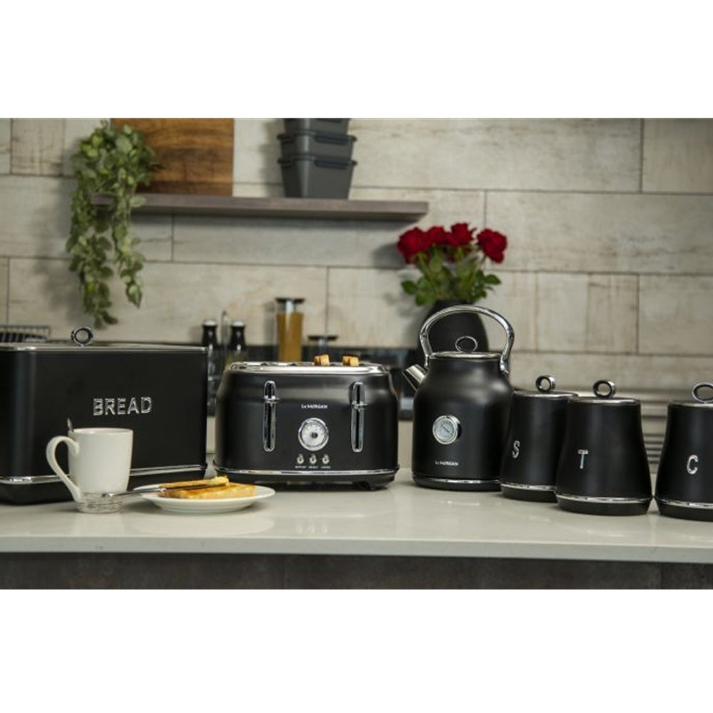 Black kitchen set including a toaster, kettle, and storage canisters on a kitchen counter.