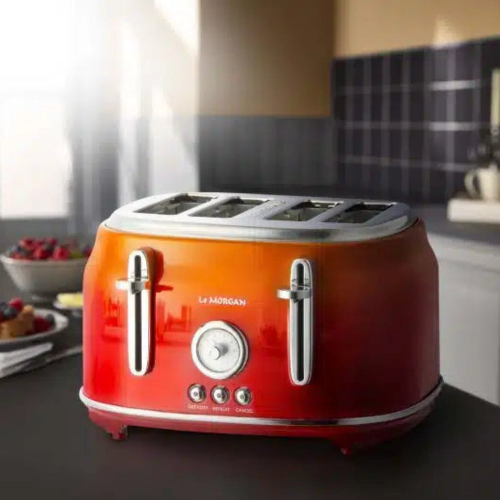 Orange Le Morgan toaster on a kitchen counter.