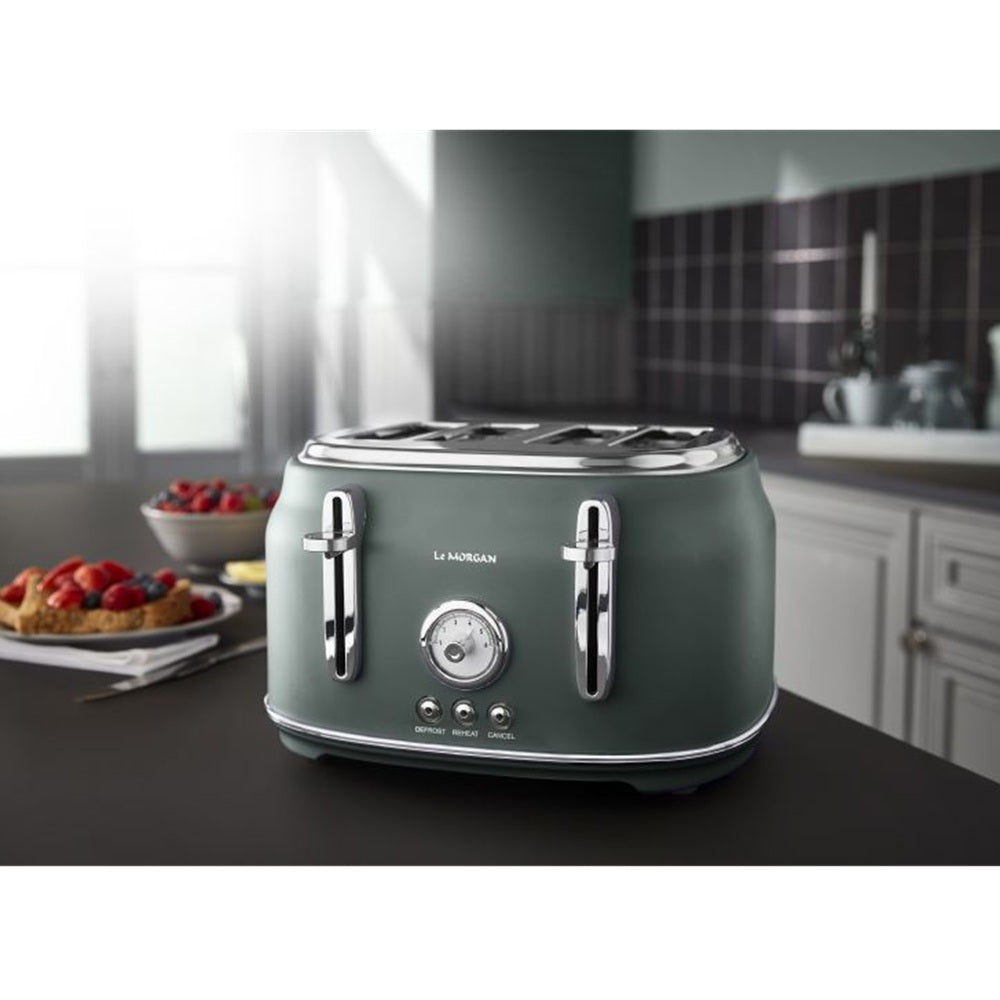 Green toaster on a kitchen counter with a blurred background