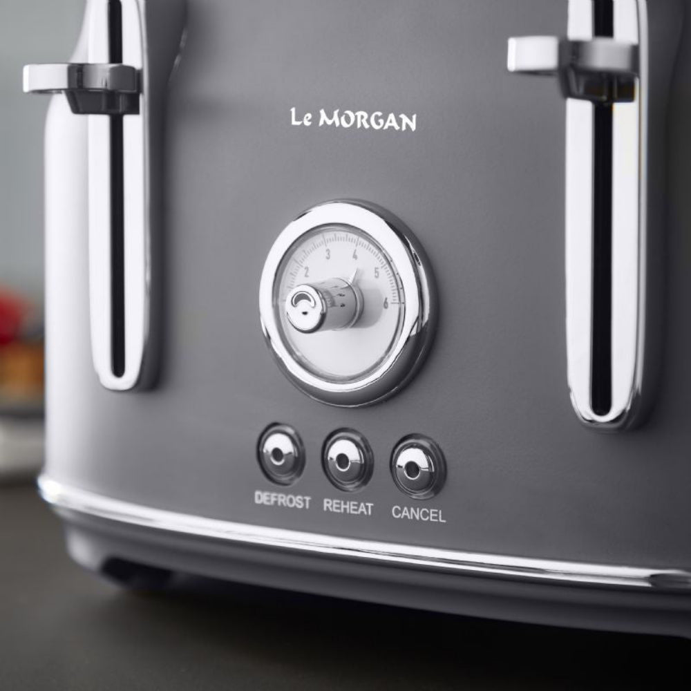 Gray toaster with silver accents and Le Morgan branding on a blurred background