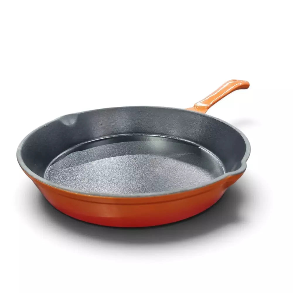 A Le Morgan Cast Iron Frying Pan 26cm Flame Orange with a textured dark gray interior and a vibrant orange exterior and handle, shown on a clean white background.