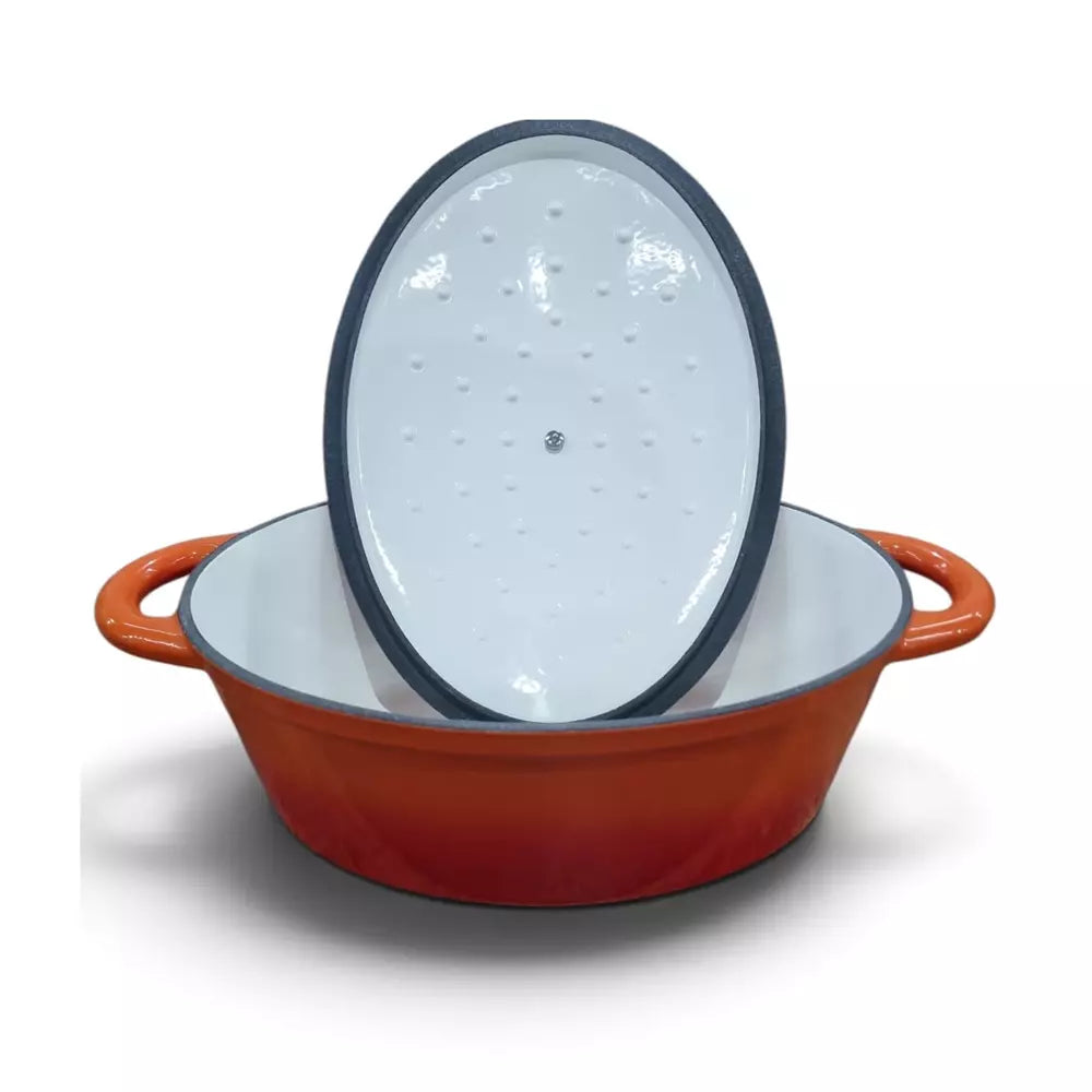 An oval-shaped enameled cast iron casserole dish with a glossy orange-red exterior, white interior, and a matching white lid with a dark rim, shown on a white background.