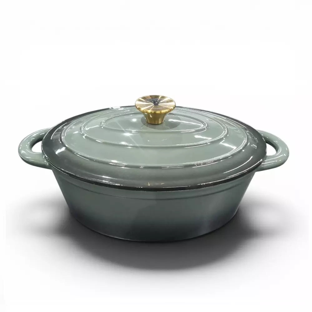 Green enameled cast iron cookware pot with lid on a white background