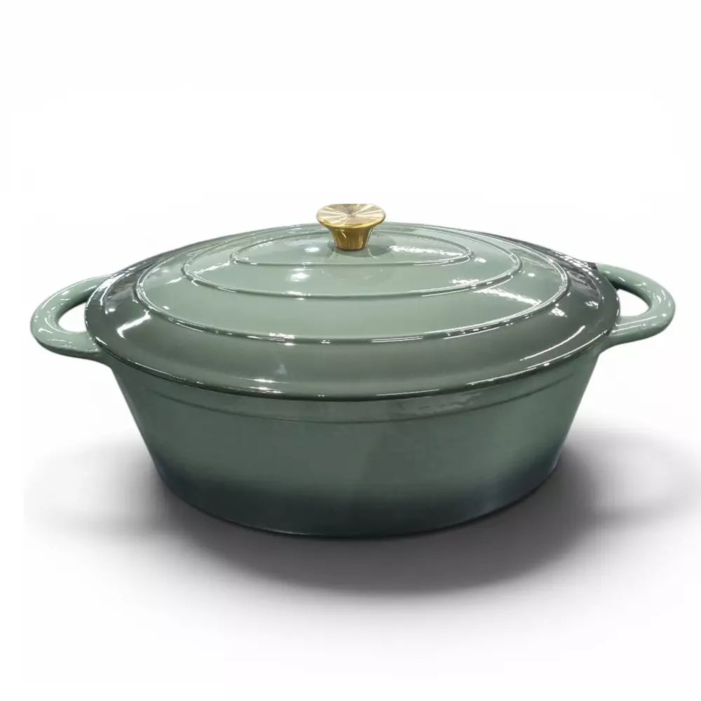 Green enameled cast iron casserole pot with a gold knob on a white background
