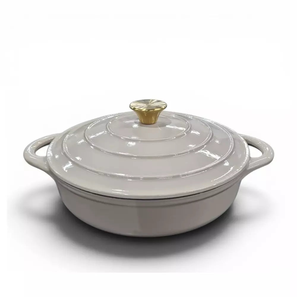 Beige cast iron pot with a gold lid knob on a white background