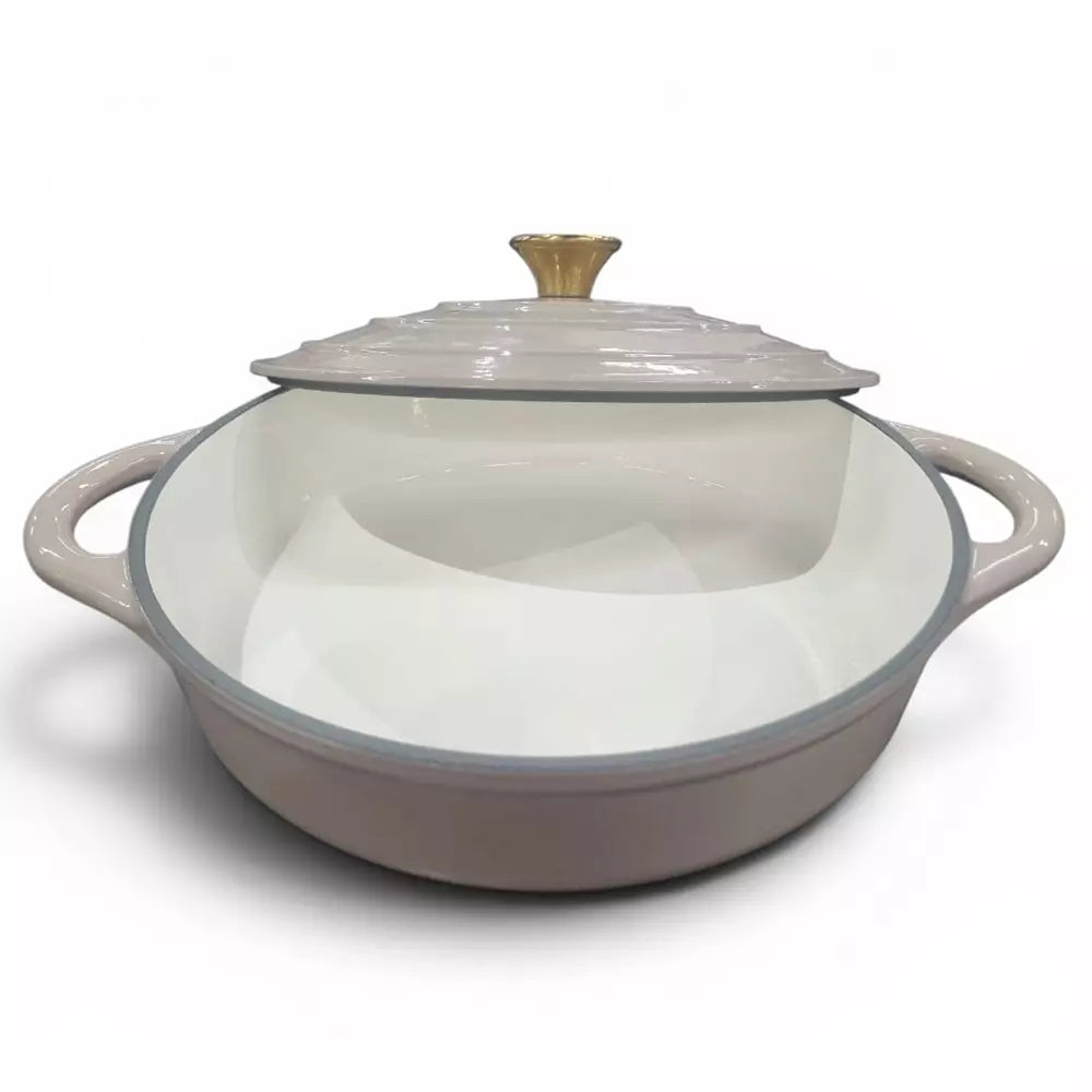 Beige enameled cast iron cookware with lid on a white background