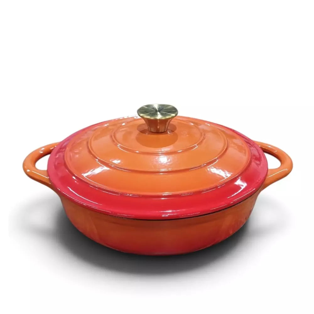 A Le Morgan Flame Orange Cast Iron Shallow Casserole Pot, on a white background