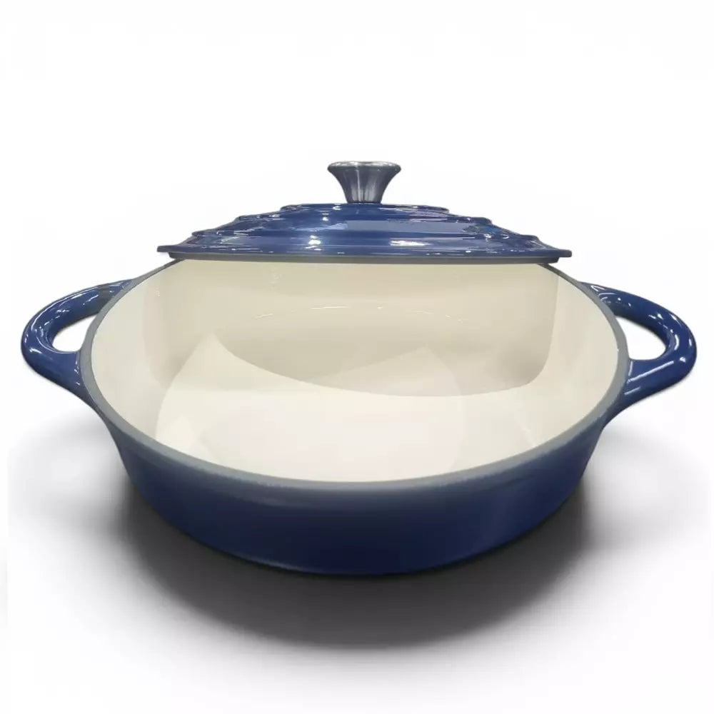 Blue enameled cast iron casserole dish with a lid on a white background