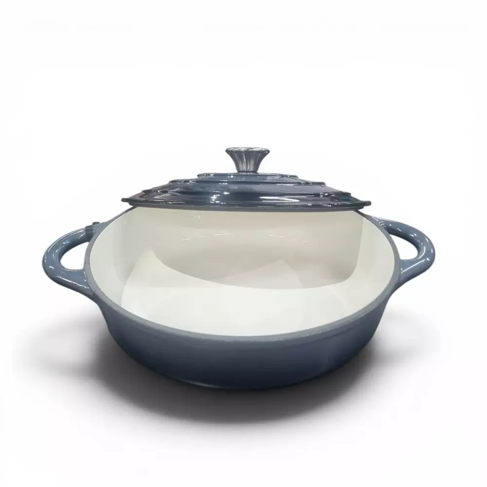 Ombre grey cast iron shallow casserole pot on white background