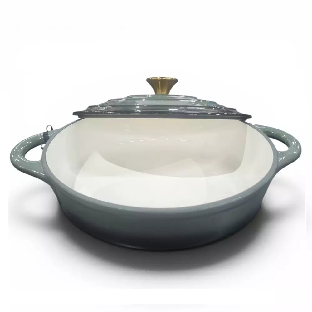 Ombre green cast iron casserole pot with white interior on a white background