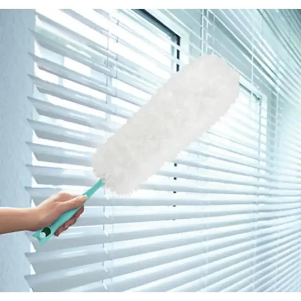 Person cleaning blinds with a duster