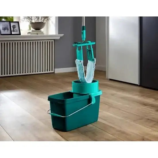 Green cleaning bucket with squeegee on a wooden floor