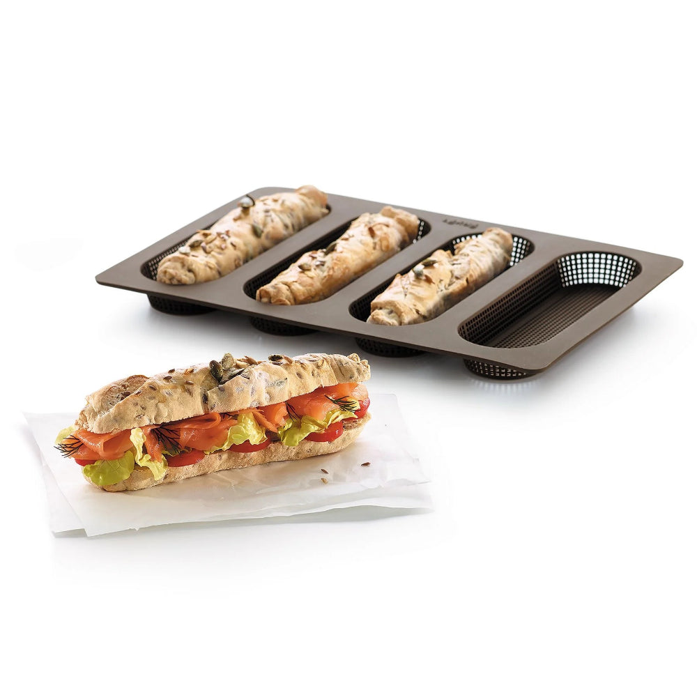 Loaf pan with mini baguettes on a white background