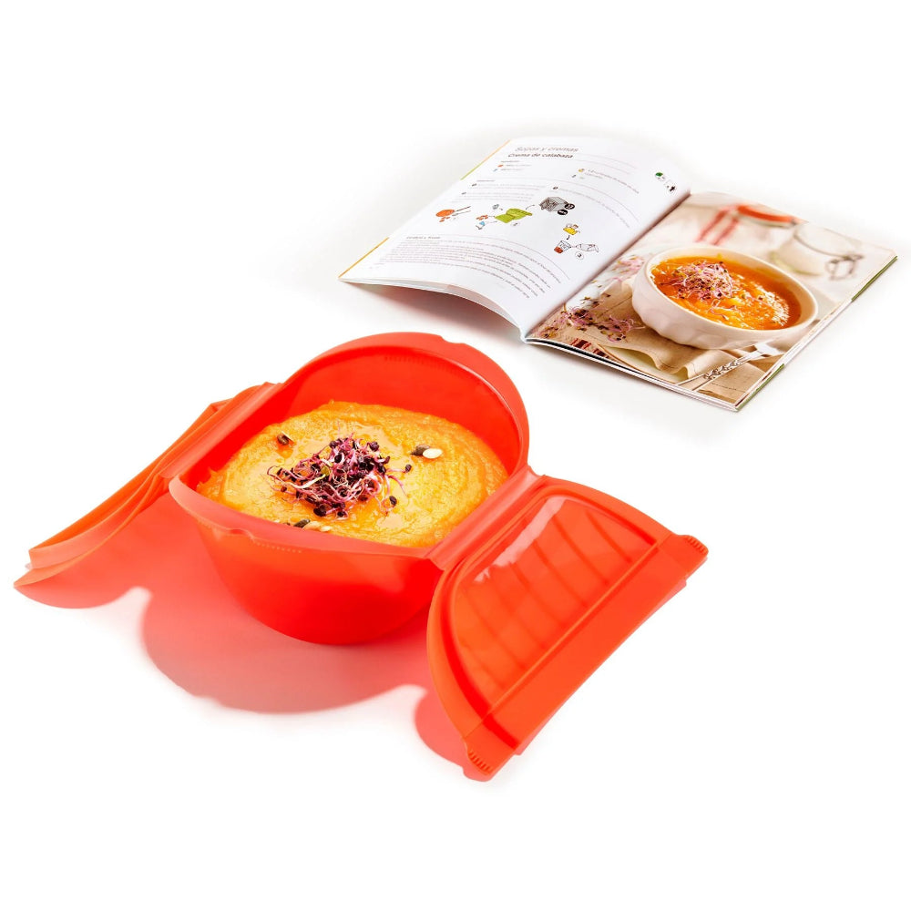 Orange tupperware and recipe book on a white background