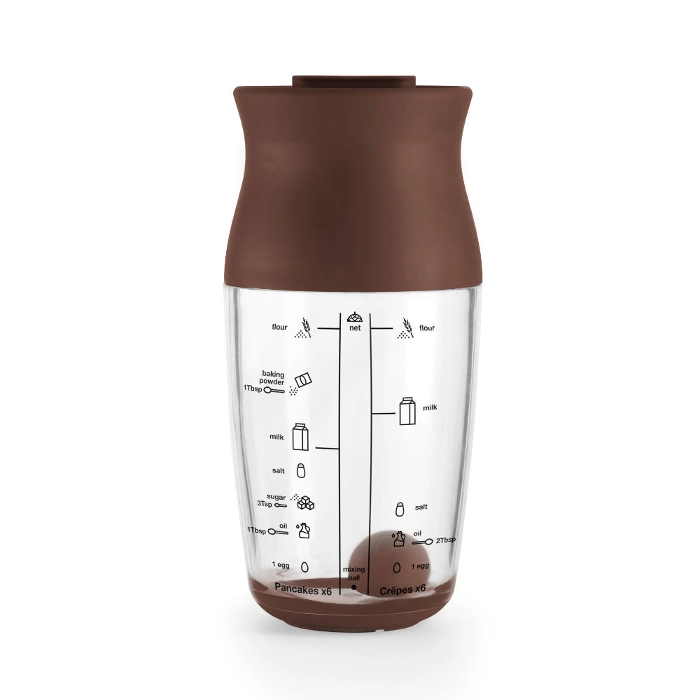 Pancake batter shaker with a white background