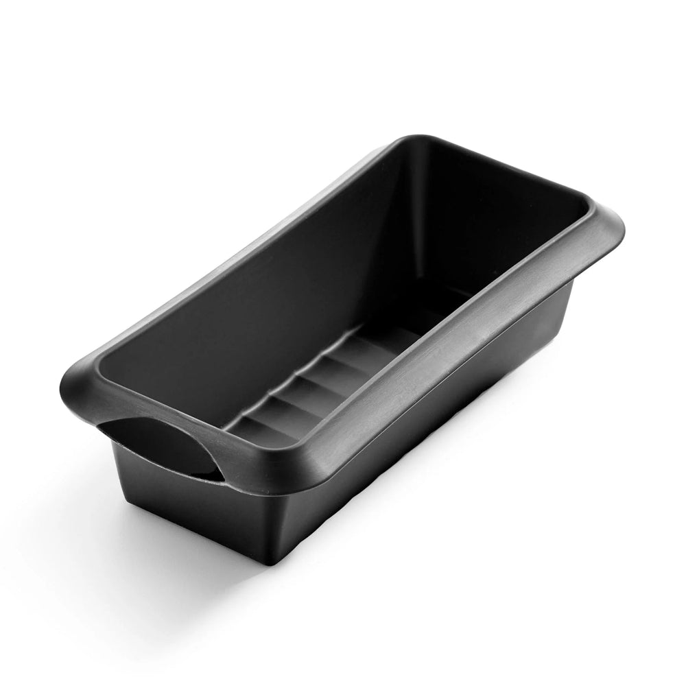 Black silicone cake mould with a white background