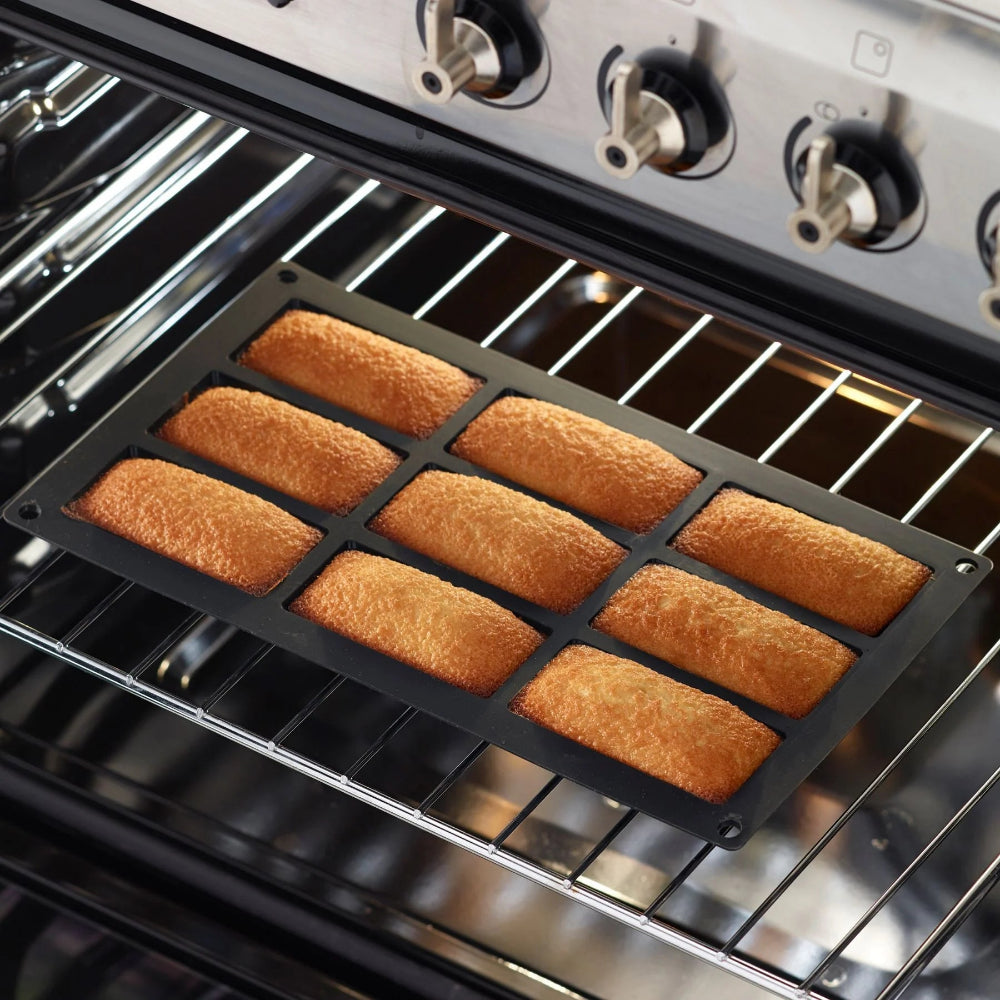 Mini cakes in a black baking mould 