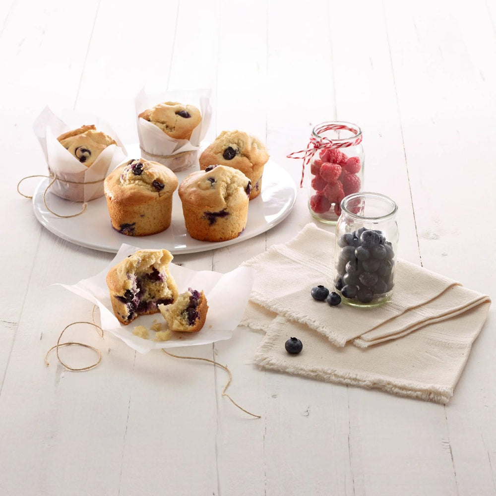 Blueberry muffins on a wooden surface 