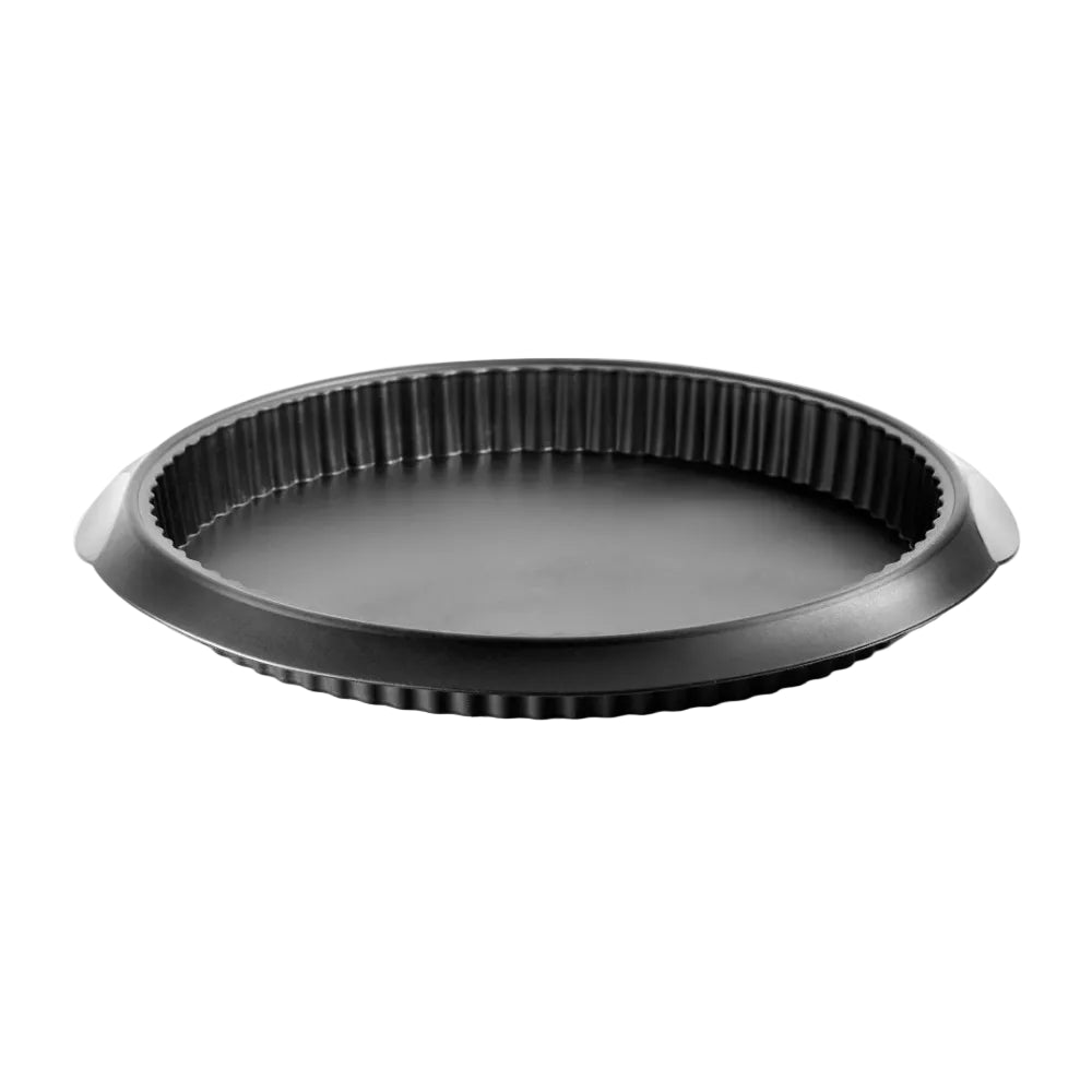 Black quiche mould with a white background