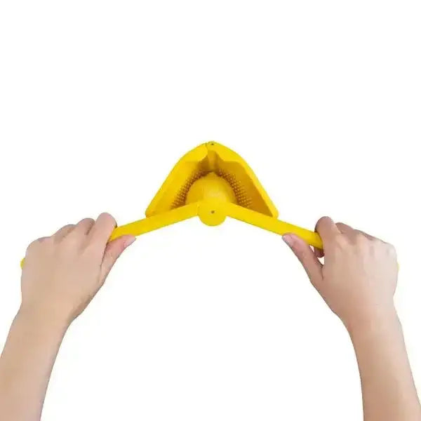 Hands using yellow lemon juicer squeezer, kitchenware from Cookin Stores on white background