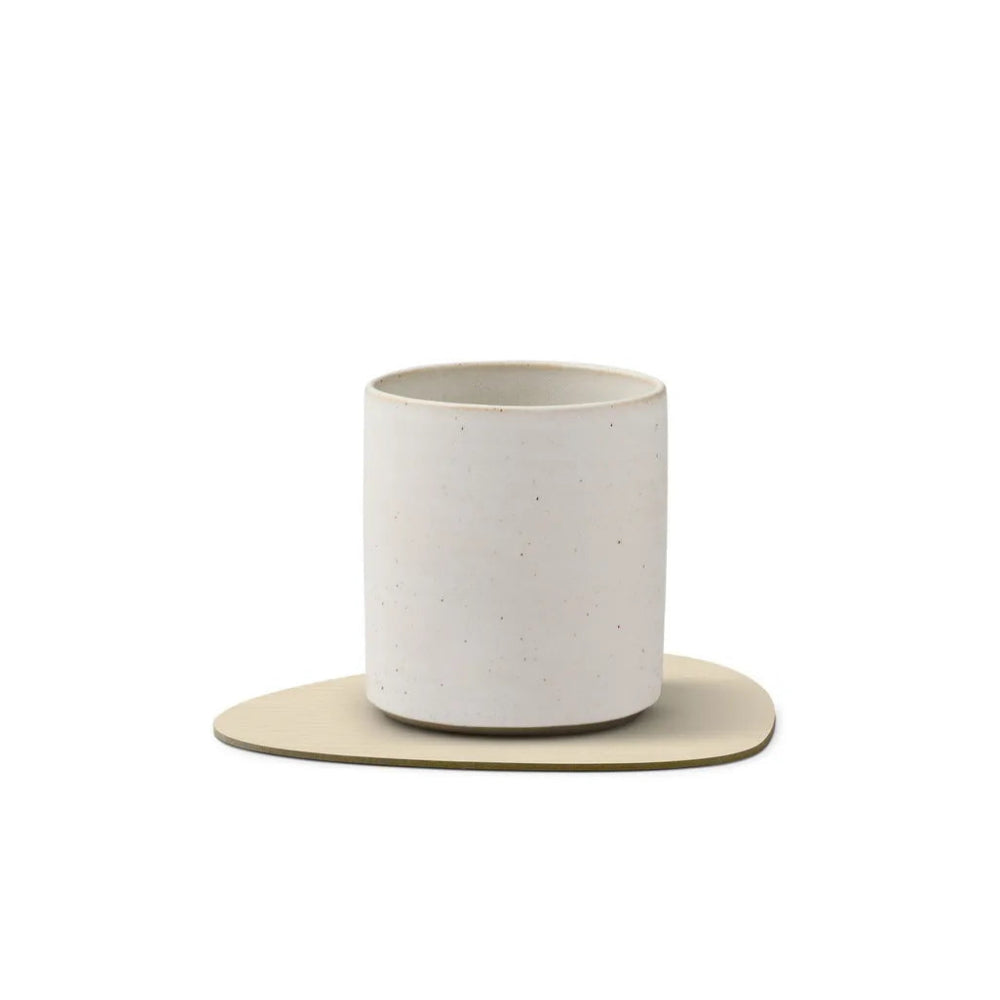 White ceramic cup with a matching saucer on a white background