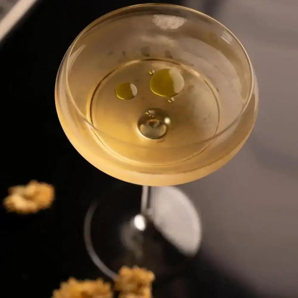 Close-up of a cocktail in a glass with a dark background