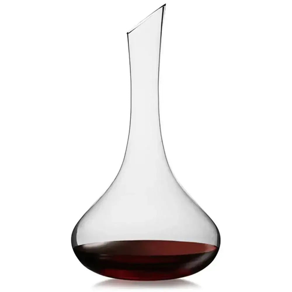 Clear wine decanter with red wine at the bottom on a white background