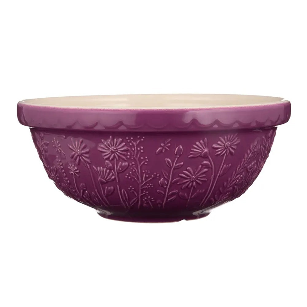 Purple ceramic bowl with decorative patterns on a white background