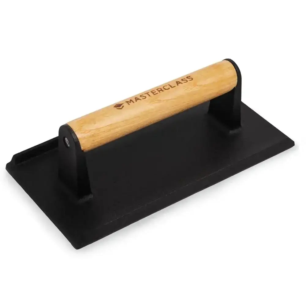 Black metal tool with wooden handle on a white background, branded 'Masterclass'.