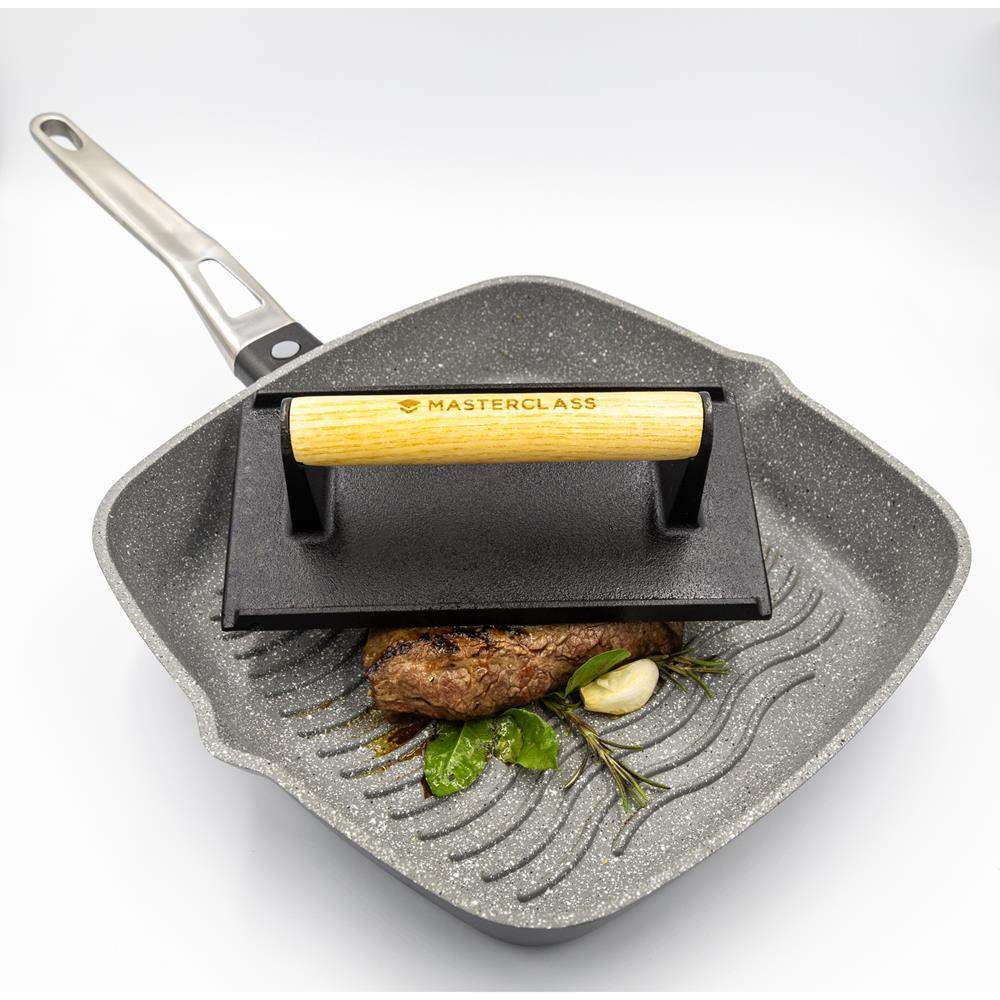 Square frying pan with grill plate and wooden handle, featuring 'Masterclass' branding.