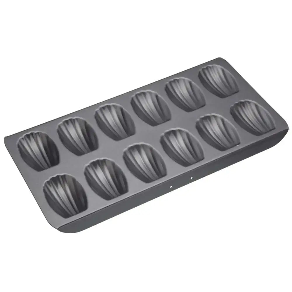 Gray madeleine cake mold on a white background