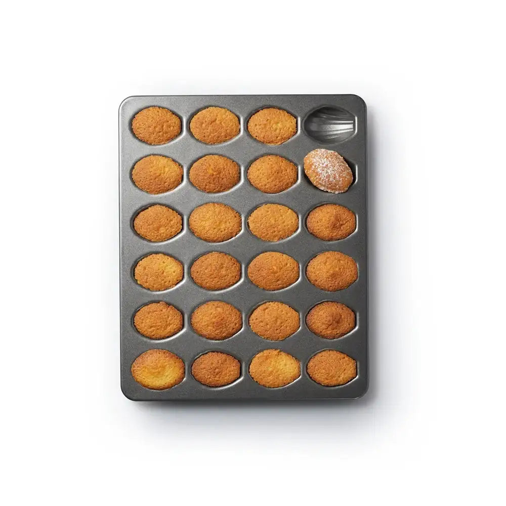 Bakery tray with freshly baked muffins on a white background