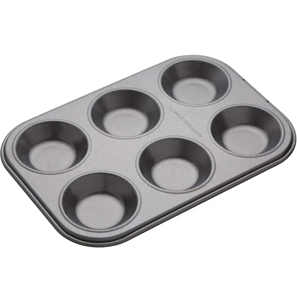 Gray muffin tin with six compartments on a white background
