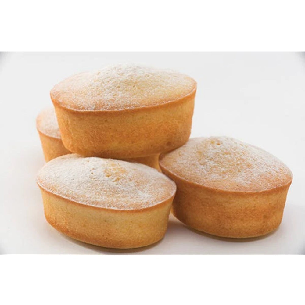 Four small round cakes dusted with powdered sugar on a white background