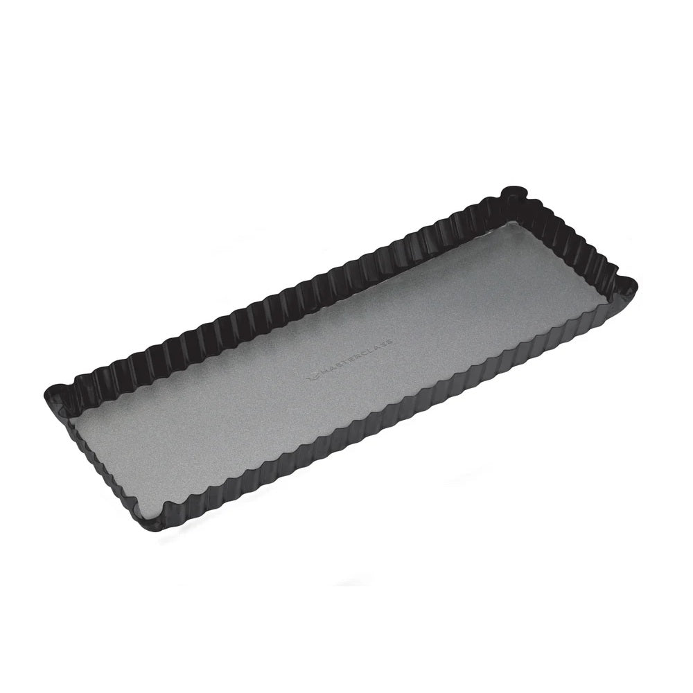 Rectangular black tart pan with a gray interior on a white background