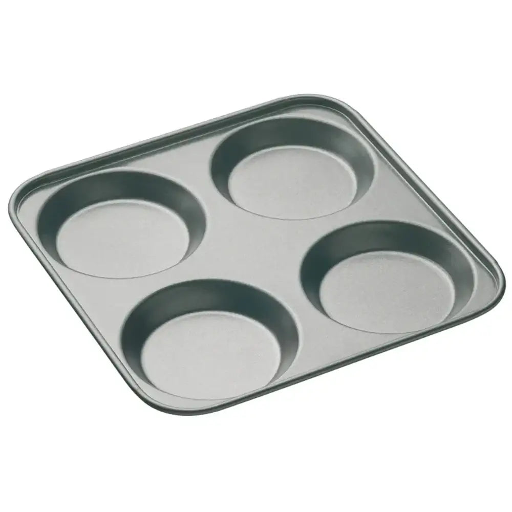 Metal muffin tray with four compartments on a white background