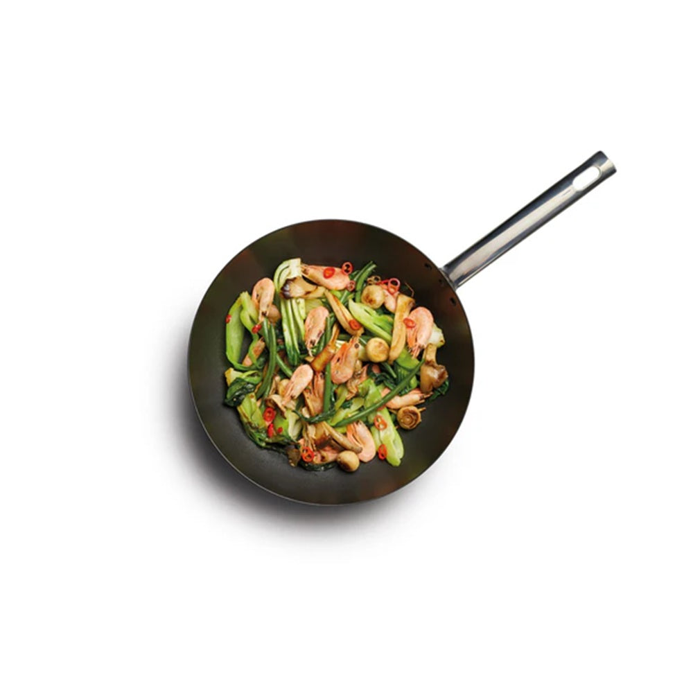 Frying pan with stir-fry on a white background