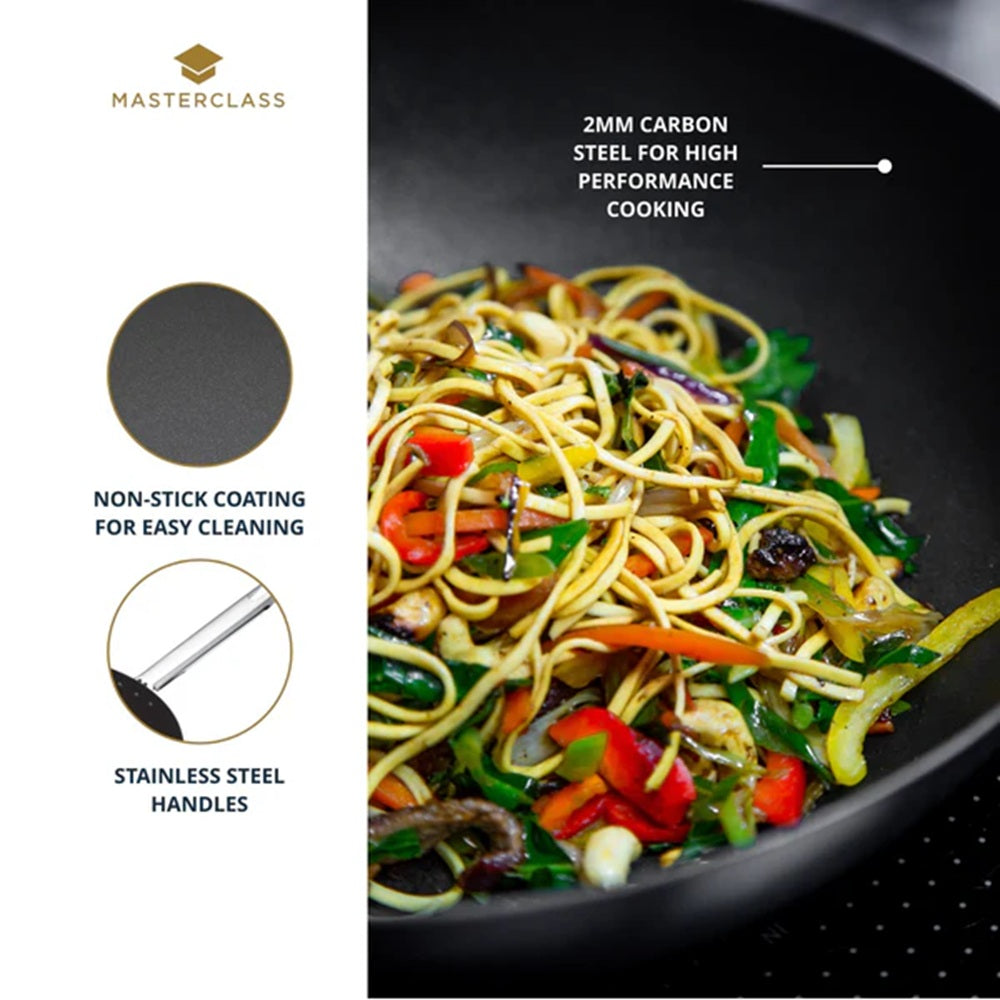 Black wok with stir-fried vegetables and noodles, featuring Masterclass branding and product features.
