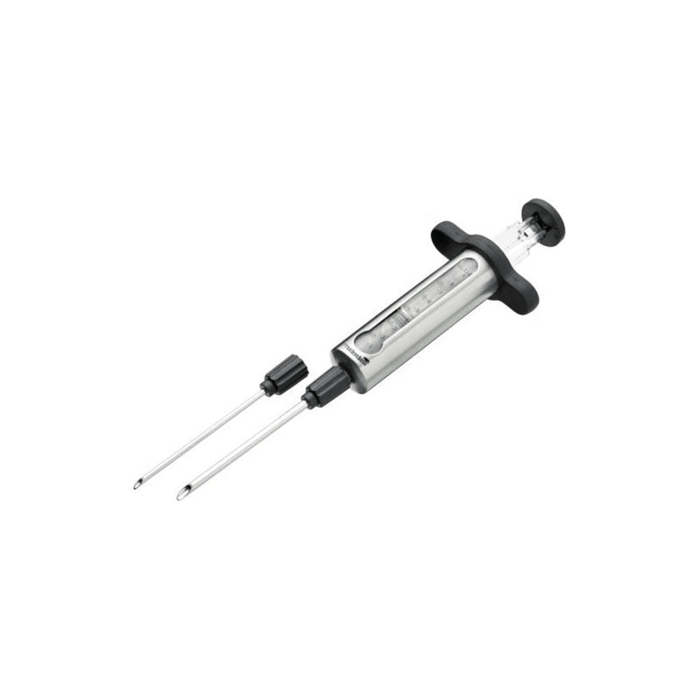 Metallic syringe with needle on a white background