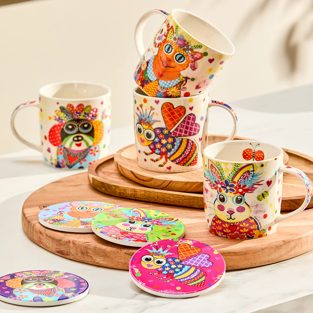 Colorful mugs and coasters with animal designs on a wooden tray.