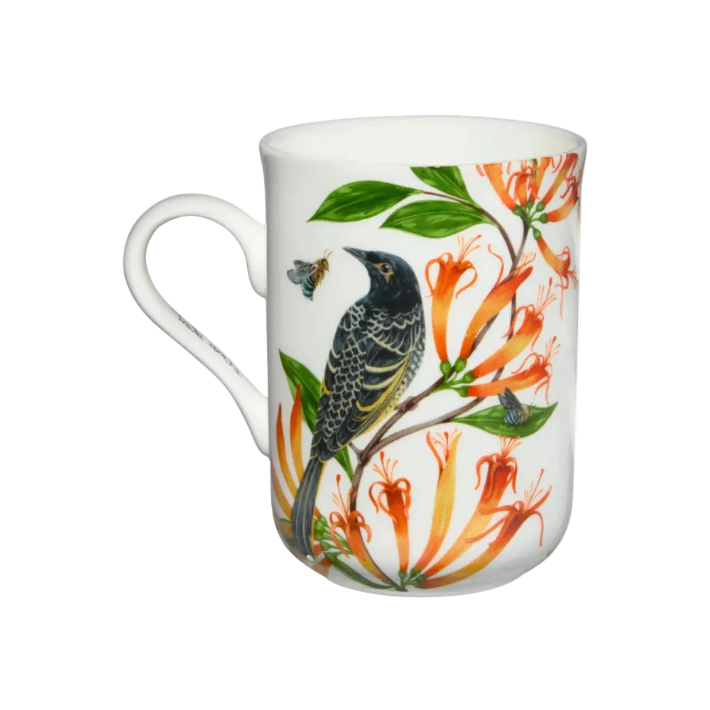 White mug with bird and floral design on a white background
