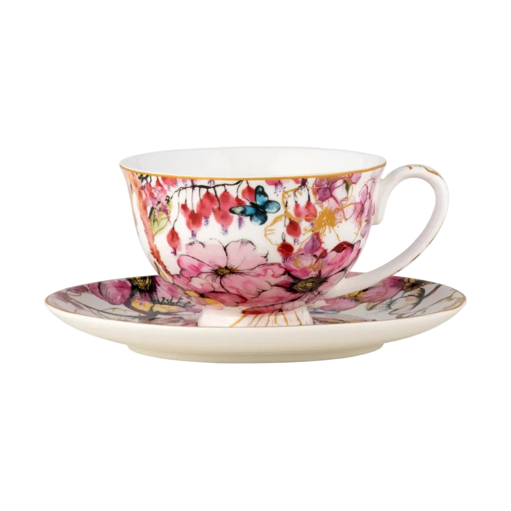 Floral teacup and saucer set on a white background