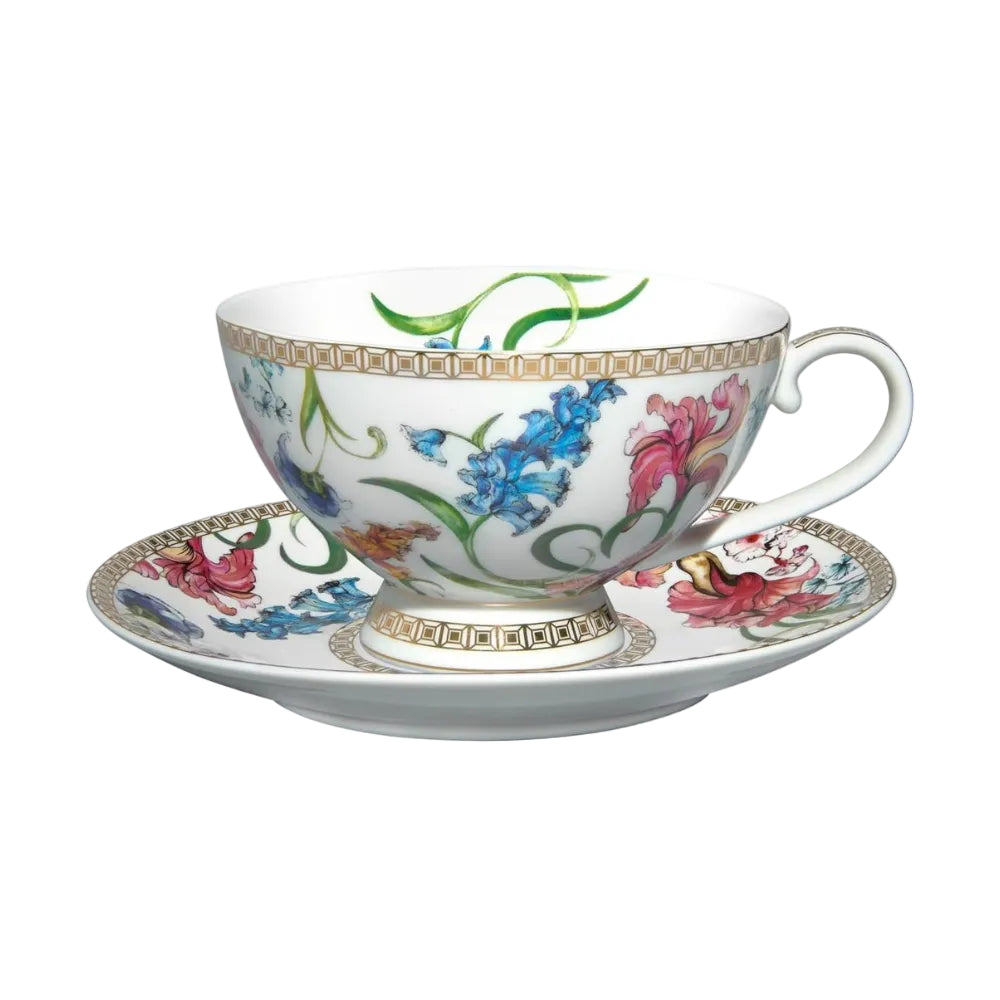 Teacup and saucer with floral design on a white background