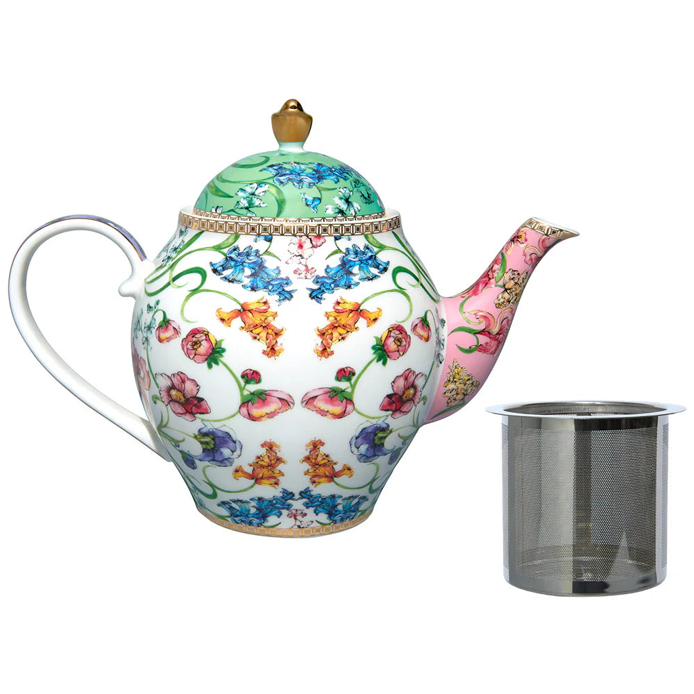 Floral teapot with a metal infuser on a white background