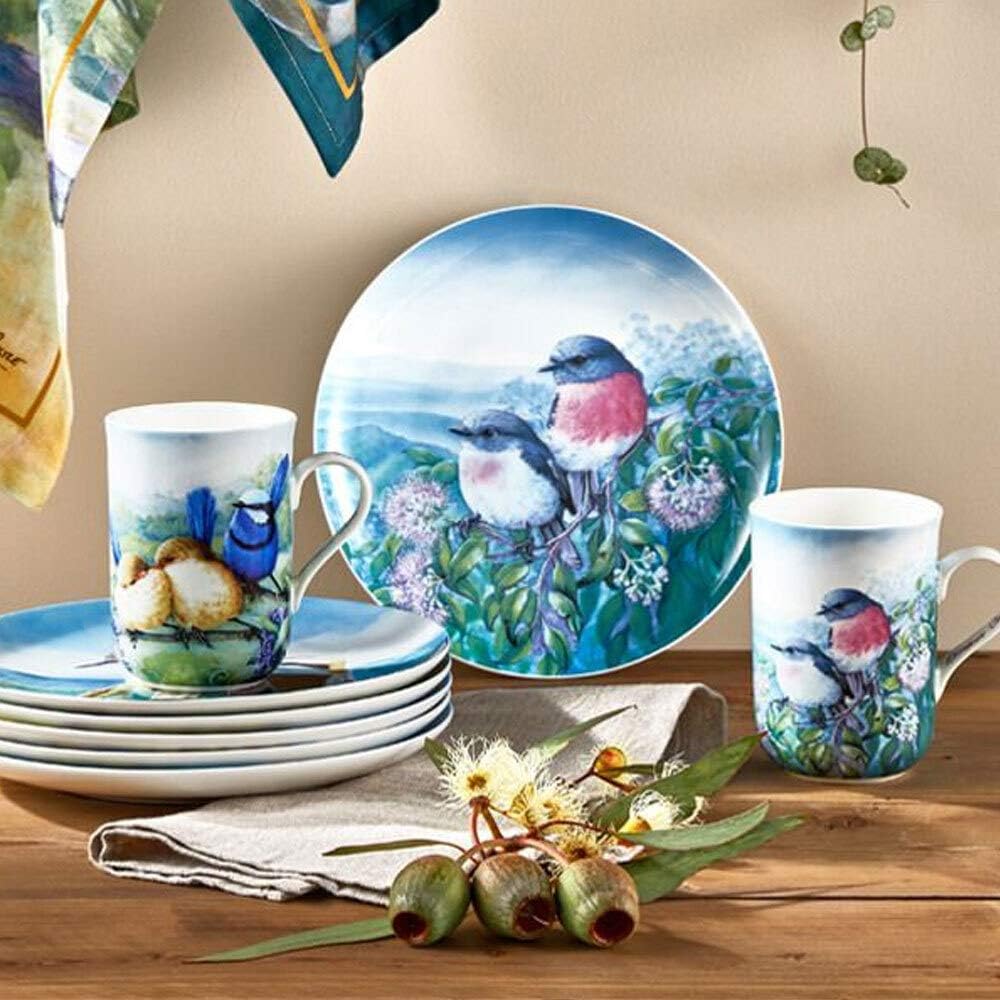 Dishware set with bird designs on a wooden table