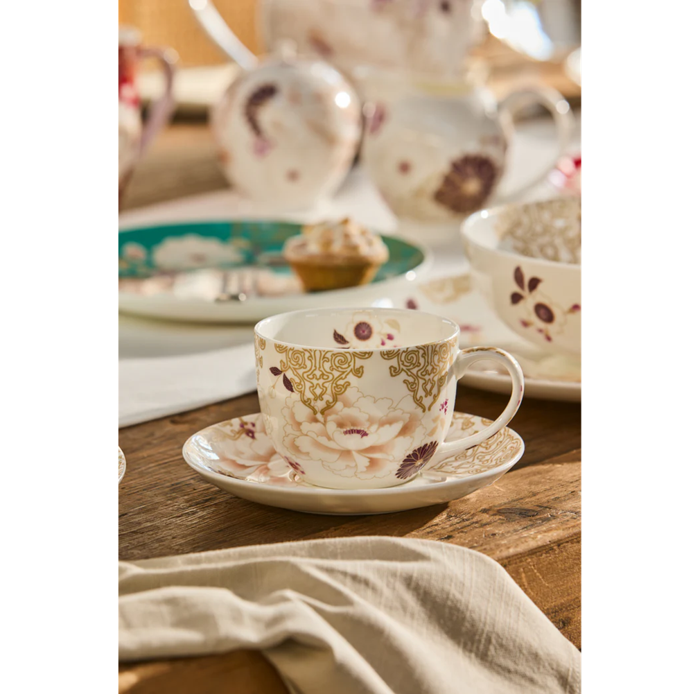 Tea cup with floral design on a wooden table