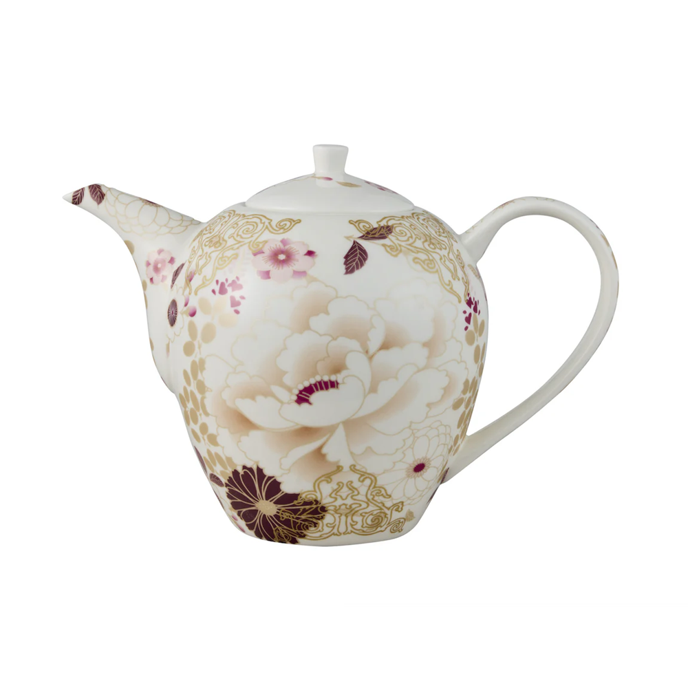Decorative teapot with floral pattern on a white background