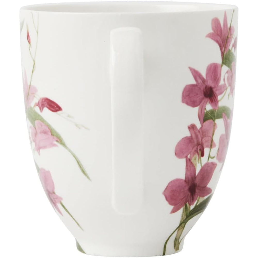 White mug with pink floral design on a white background