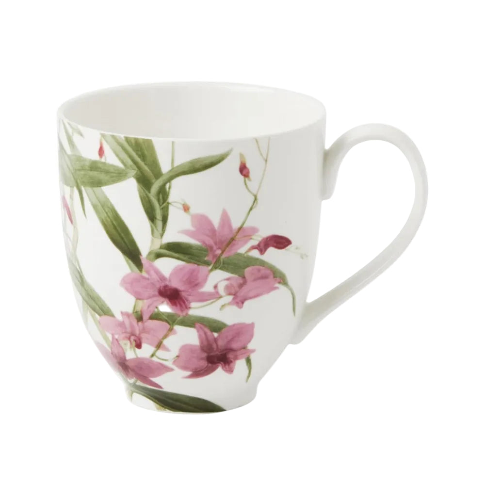 White mug with pink floral design on a white background